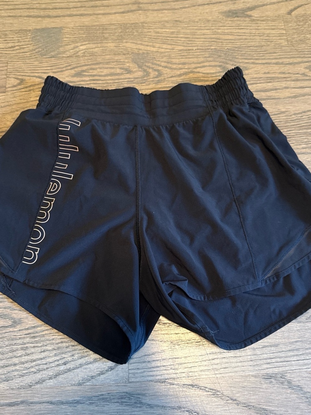 Lululemon Hotty Hot high rise lined shorts, with logo in rose gold on right side